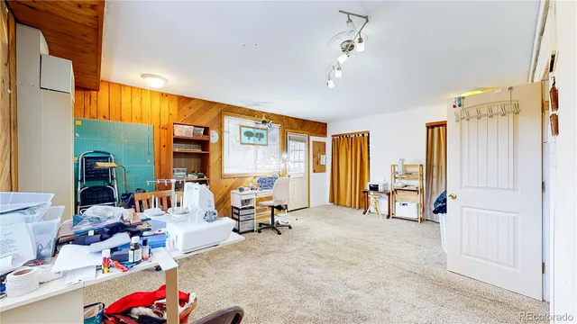 a children room with toys and a flat screen tv
