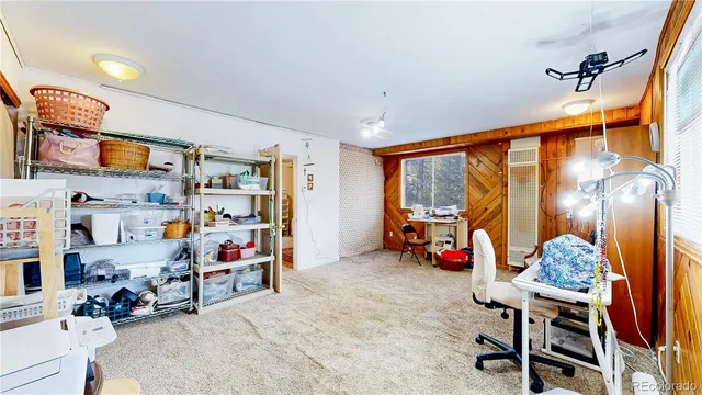 a view of a porch with wooden floor and furniture
