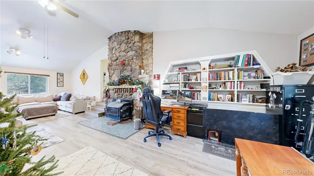 a view of a workspace with furniture and a workspace