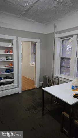 a room that has a bed and a table in it