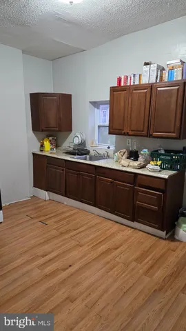 a kitchen with stainless steel appliances granite countertop a sink and cabinets