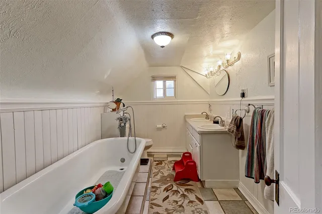 a bathroom with a tub and shower