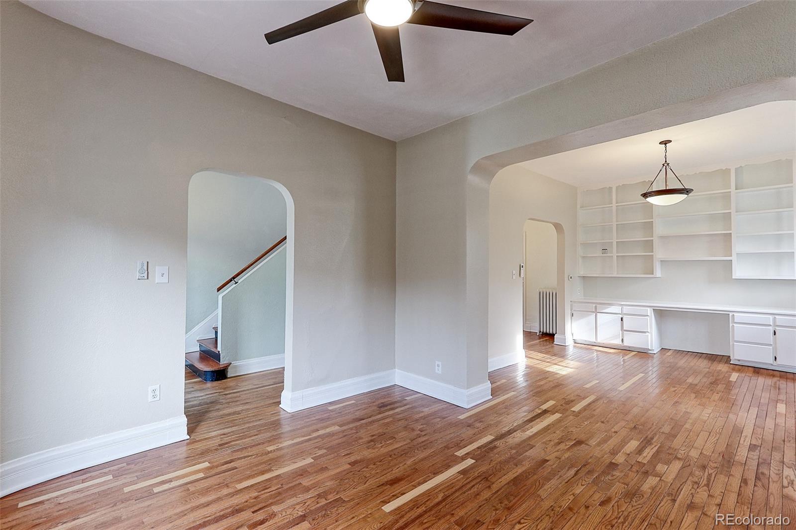 4574 Stuart Street Denver, CO 80212 - Photo 13 of 43 a view of empty room with wooden floor and window