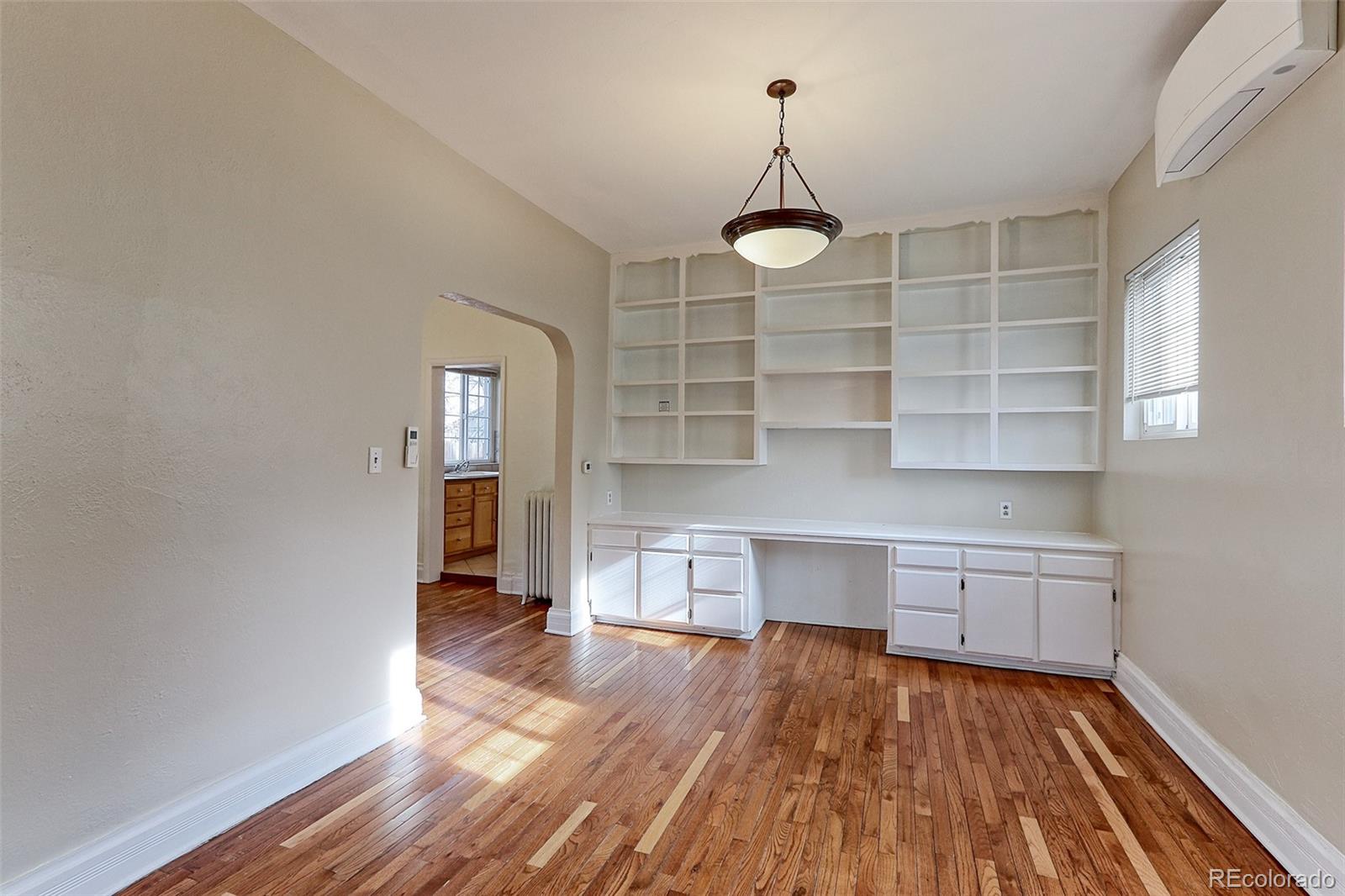 4574 Stuart Street Denver, CO 80212 - Photo 14 of 43 a kitchen with a wooden floor and window