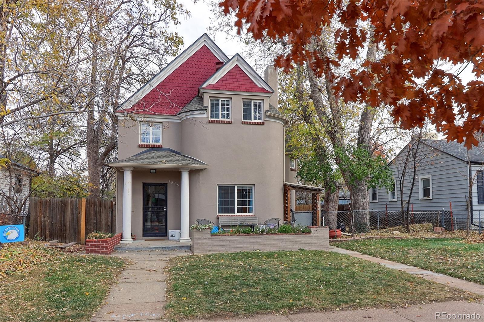 4574 Stuart Street Denver, CO 80212 - Photo 2 of 43 a front view of a house with a yard