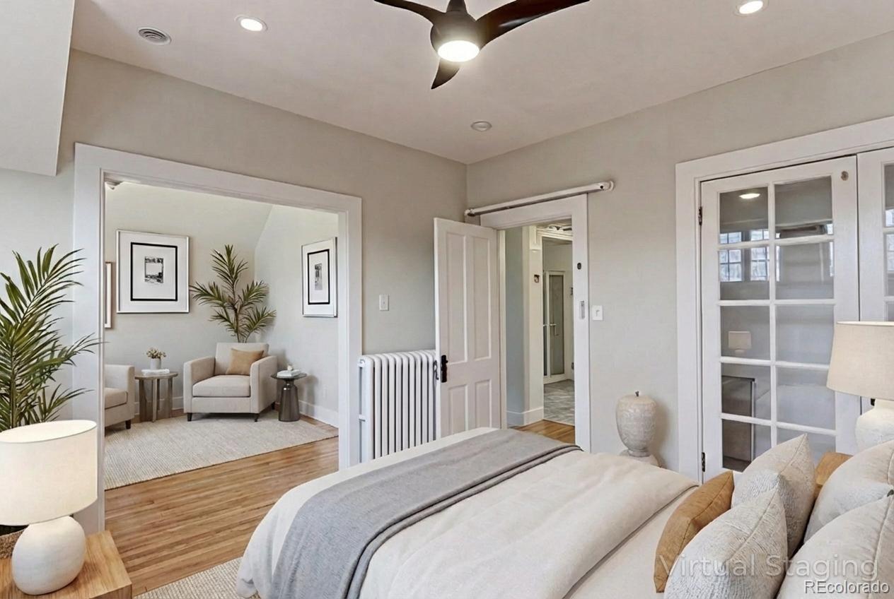 4574 Stuart Street Denver, CO 80212 - Photo 24 of 43 a bedroom with furniture and a large window