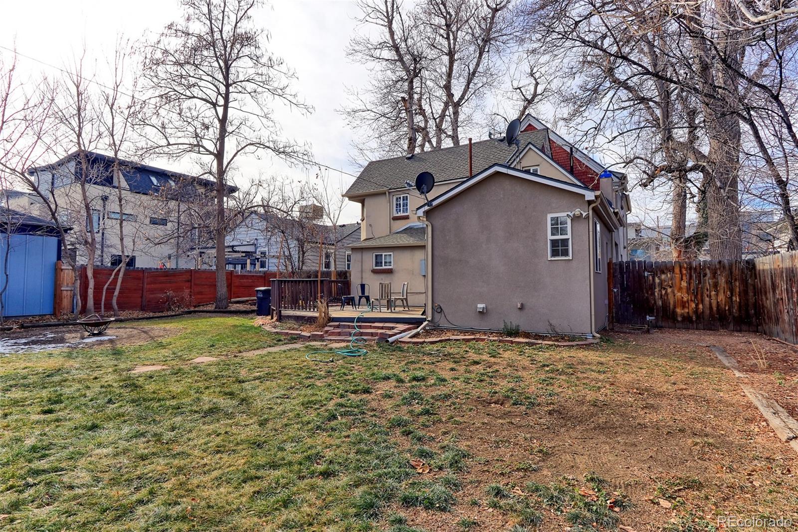 4574 Stuart Street Denver, CO 80212 - Photo 34 of 43 a house with trees in front of it