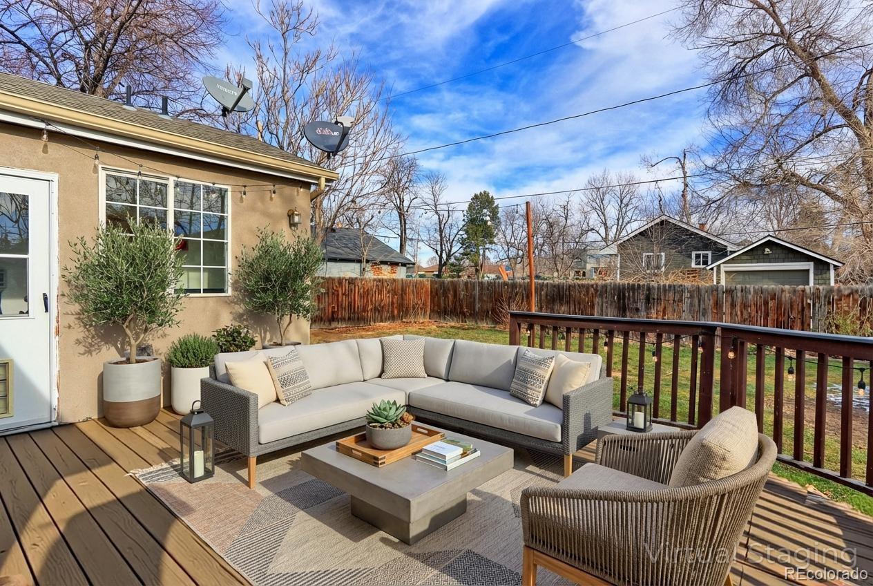 4574 Stuart Street Denver, CO 80212 - Photo 41 of 43 a roof deck with couches and potted plants