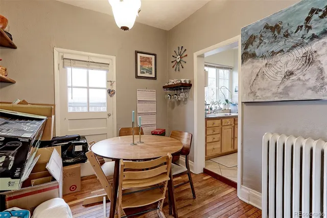 a dining room with furniture and window