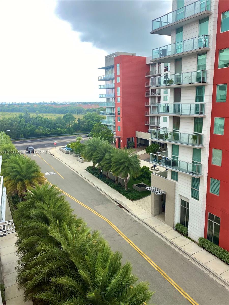 a view of building with yard and mountain view