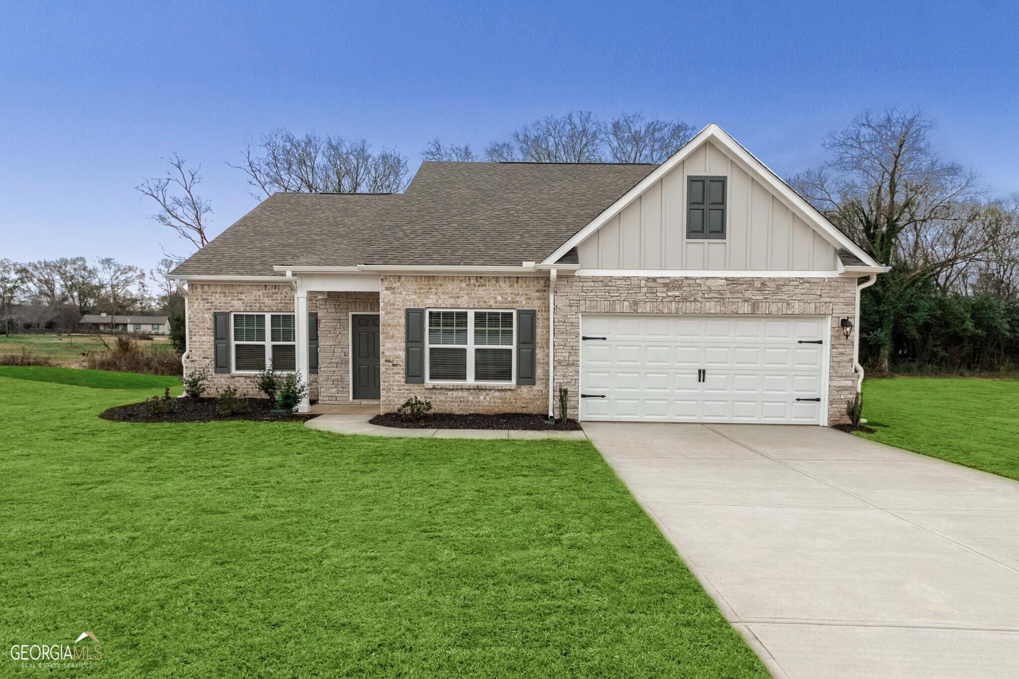 1242 Fendt Drive Locust Grove, GA 30248 - Photo 1 of 1 a front view of a house with a yard