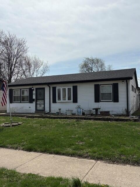 3320 163rd Street Hammond, IN 46323 - Photo 1 of 10 a front view of a house with a garden