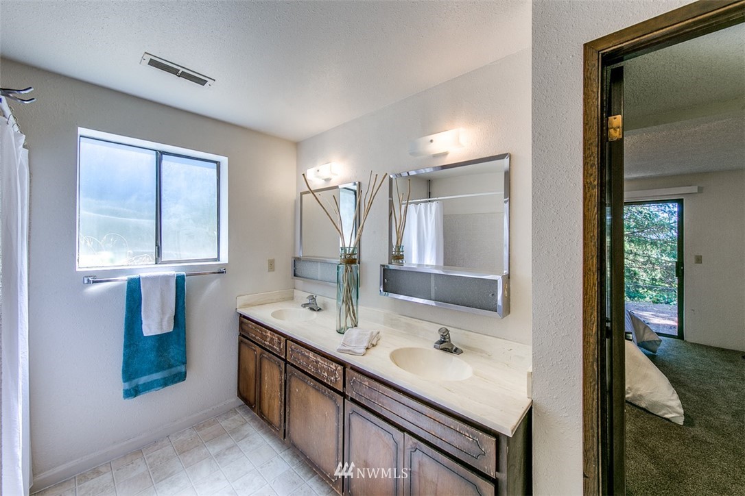 705 Sheridan Road Bremerton, WA 98310 - Photo 17 of 25 a bathroom with a sink double vanity and a mirror