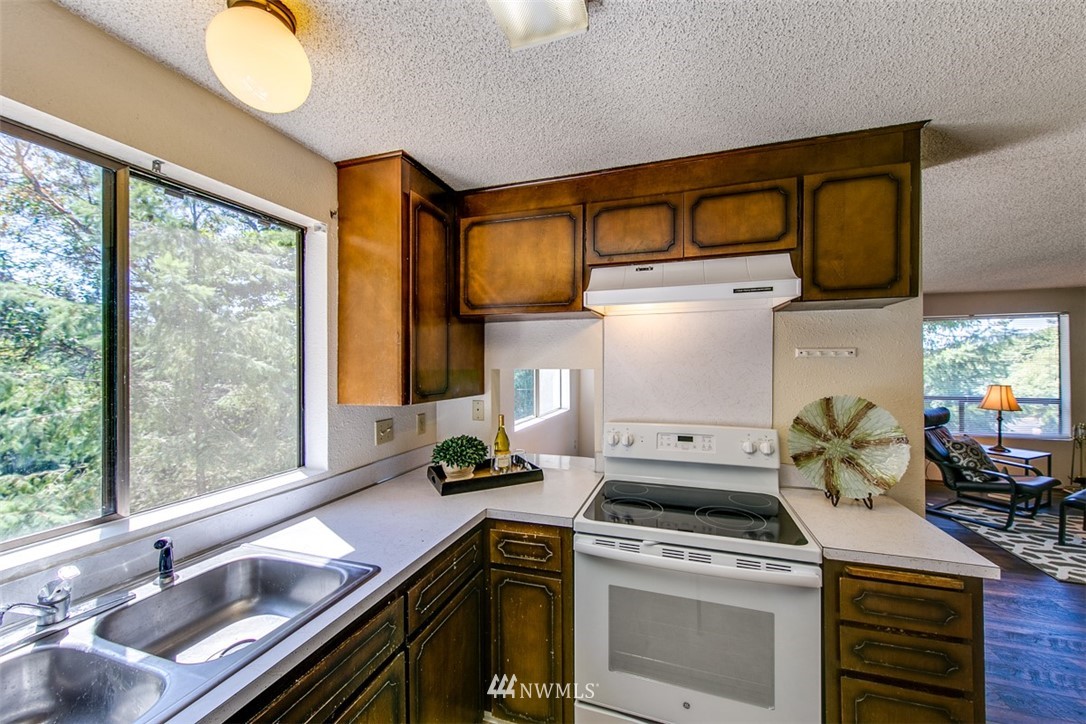 705 Sheridan Road Bremerton, WA 98310 - Photo 6 of 25 a kitchen with a stove and a sink