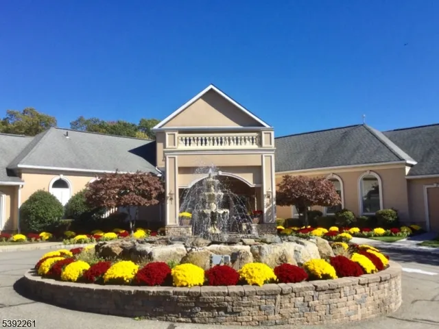 a view of a house with swimming pool and porch