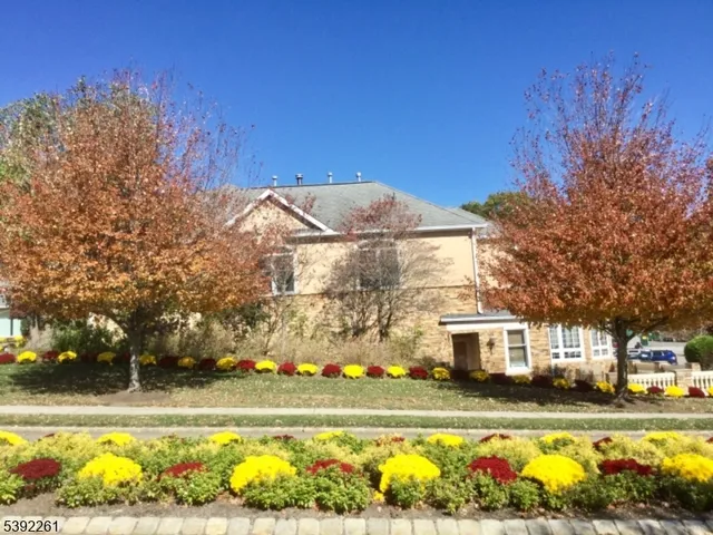 a view of a swimming pool with outdoor seating