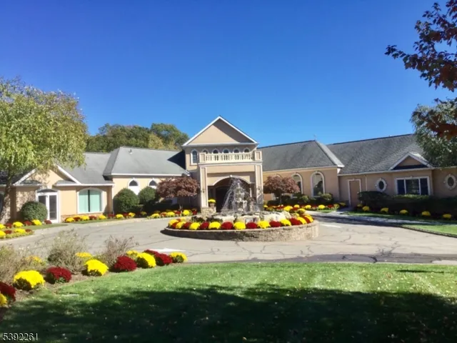a front view of house with yard and seating area