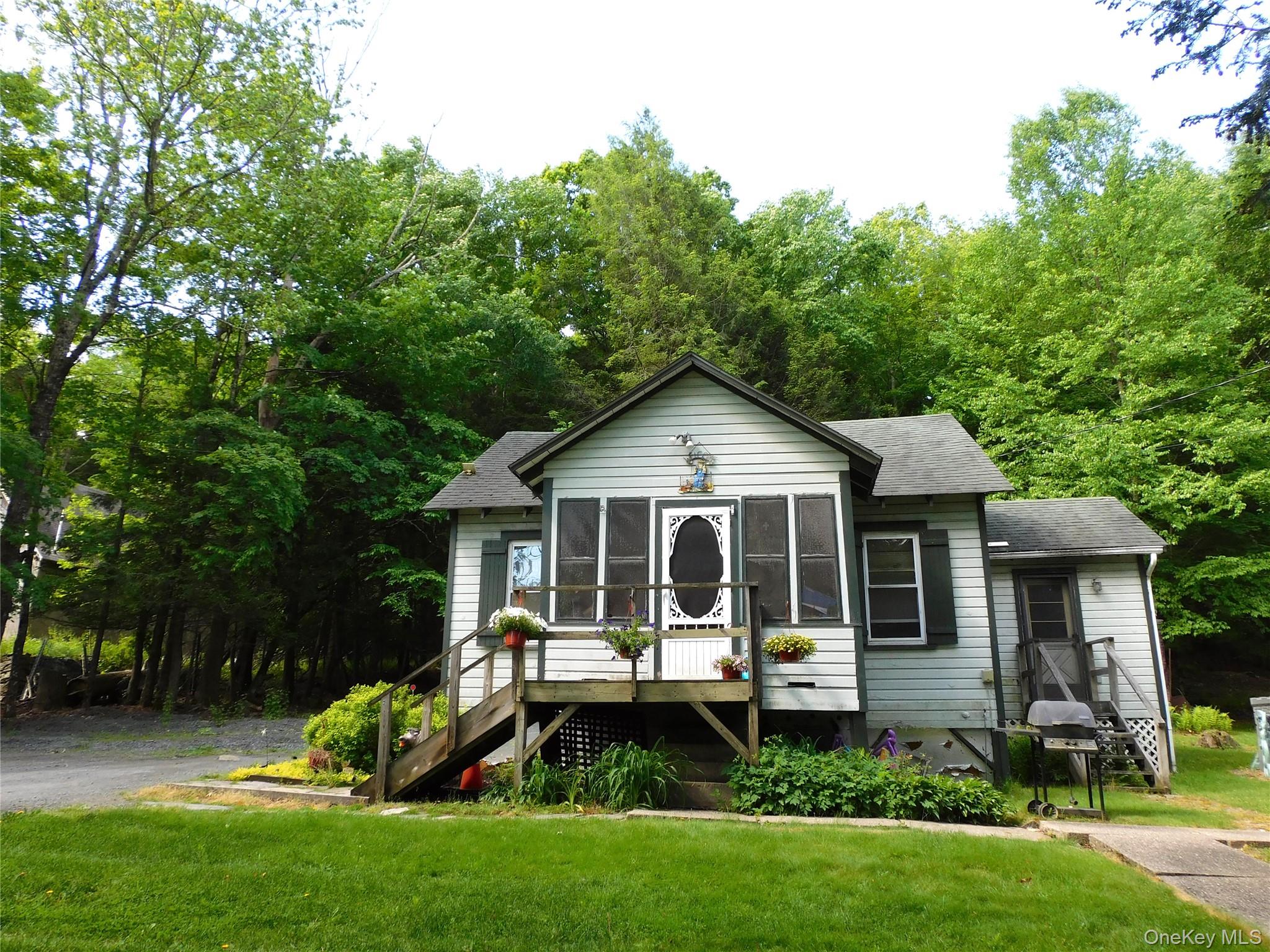 18-20 Church Road Mountain Dale, NY 12763 - Photo 2 of 20 a front view of house with a garden