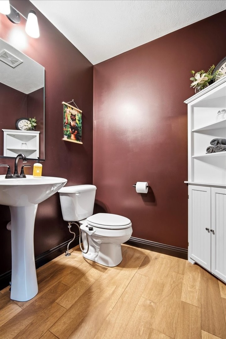2625 Shale Road Normal, IL 61761 - Photo 37 of 60 a bathroom with a sink a toilet and a mirror