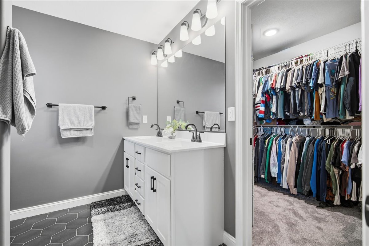 2625 Shale Road Normal, IL 61761 - Photo 44 of 60 a view of walk in closet with clothes and shoes
