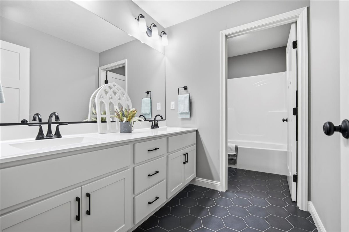 2625 Shale Road Normal, IL 61761 - Photo 48 of 60 a bathroom with a double vanity sink mirror and bathtub
