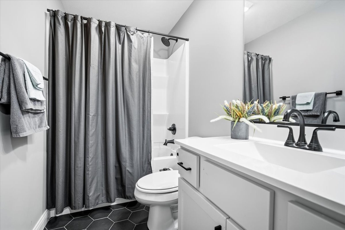 2625 Shale Road Normal, IL 61761 - Photo 59 of 60 a bathroom with a sink a toilet and shower