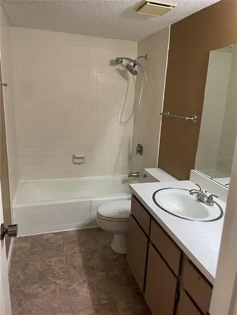 a bathroom with a sink a toilet and a bathtub
