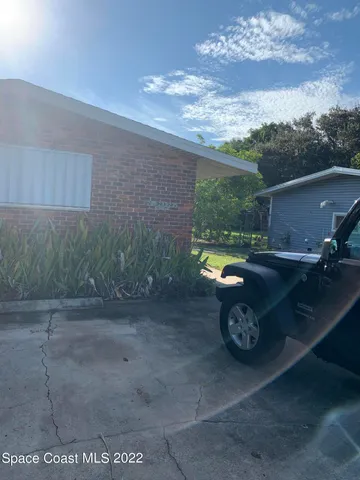 a view of a swimming pool with a yard