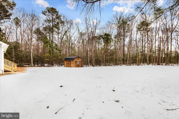 a view of outdoor space with wooden fence
