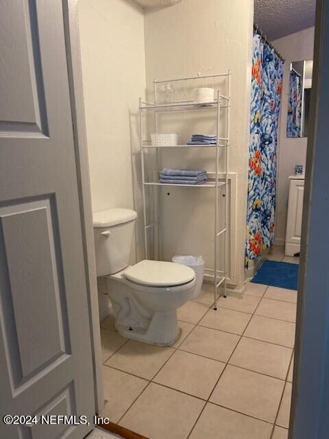 5419 Woodcrest Road Jacksonville, FL 32205 - Photo 12 of 25 a bathroom with a toilet and a shower