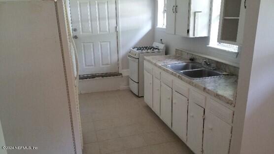 5419 Woodcrest Road Jacksonville, FL 32205 - Photo 18 of 25 a kitchen with a sink and cabinets