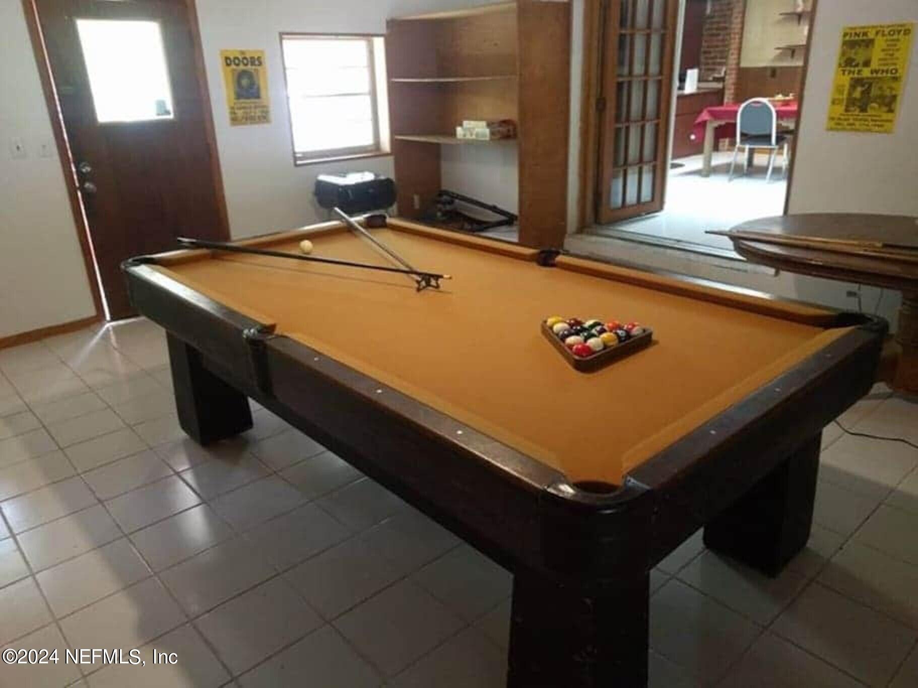 5419 Woodcrest Road Jacksonville, FL 32205 - Photo 4 of 25 a room with pool table and windows