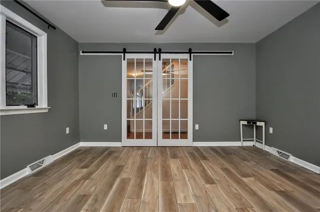 a view of room with ceiling fan