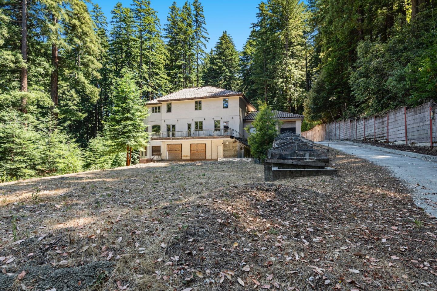1 Reids Roost Road Woodside, CA 94062 - Photo 13 of 24 a front view of a house with garden