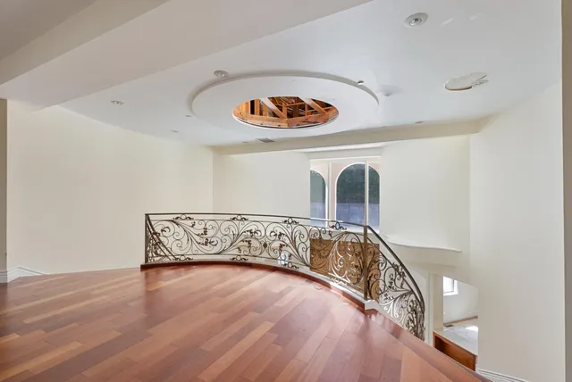 a view of room with wooden floor