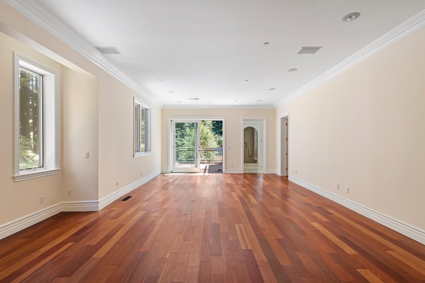 1 Reids Roost Road Woodside, CA 94062 - Photo 8 of 24 a view of an empty room with wooden floor and a window
