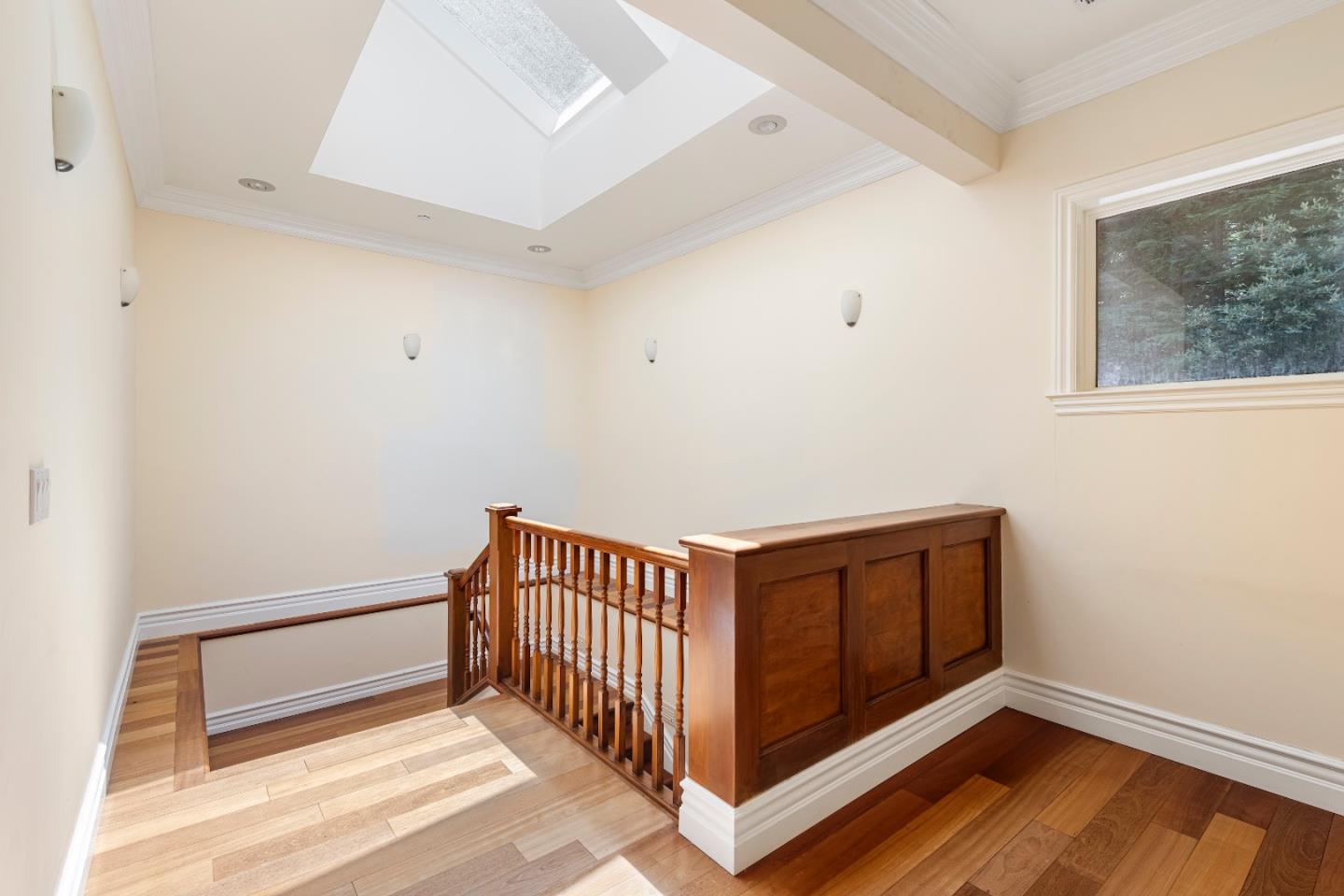 1 Reids Roost Road Woodside, CA 94062 - Photo 9 of 24 a bedroom with a bed and wooden floor