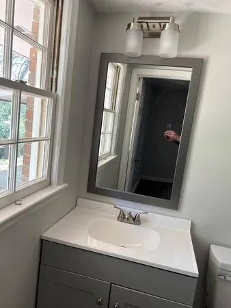 a bathroom with a sink and a mirror