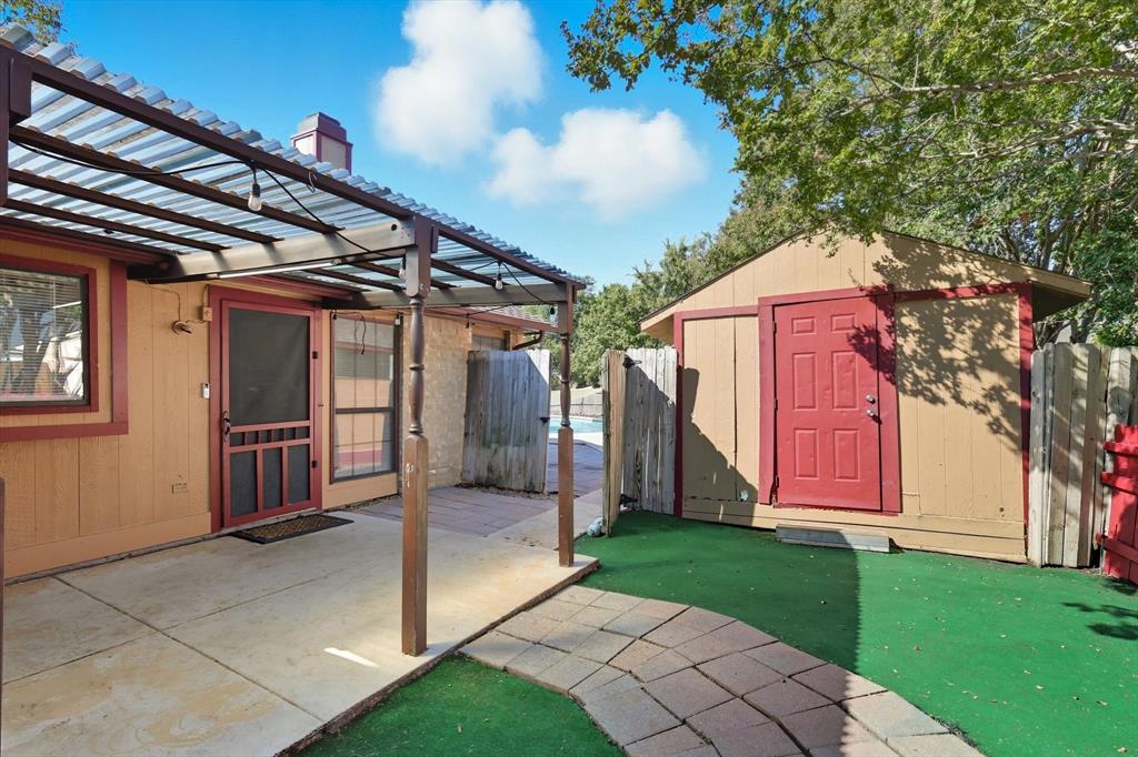 9101 Denver Street Rowlett, TX 75088 - Photo 30 of 40 a view of a house with a backyard