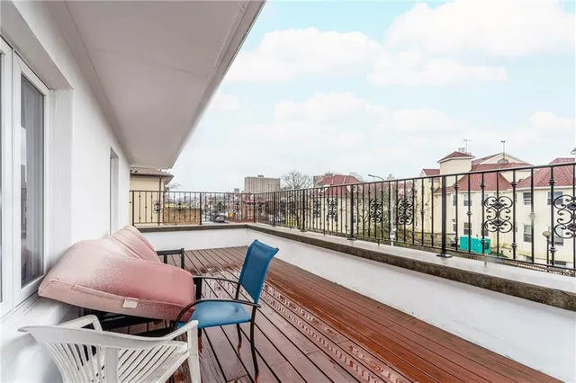 a view of balcony with furniture