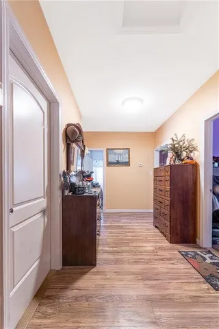 a view of a kitchen with a sink and a refrigerator