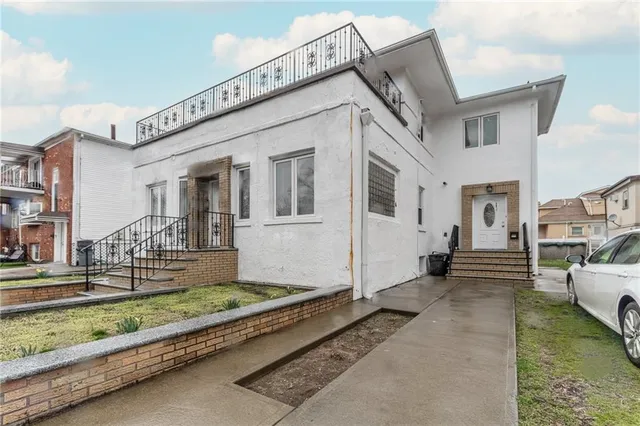a view of a white house with a large windows