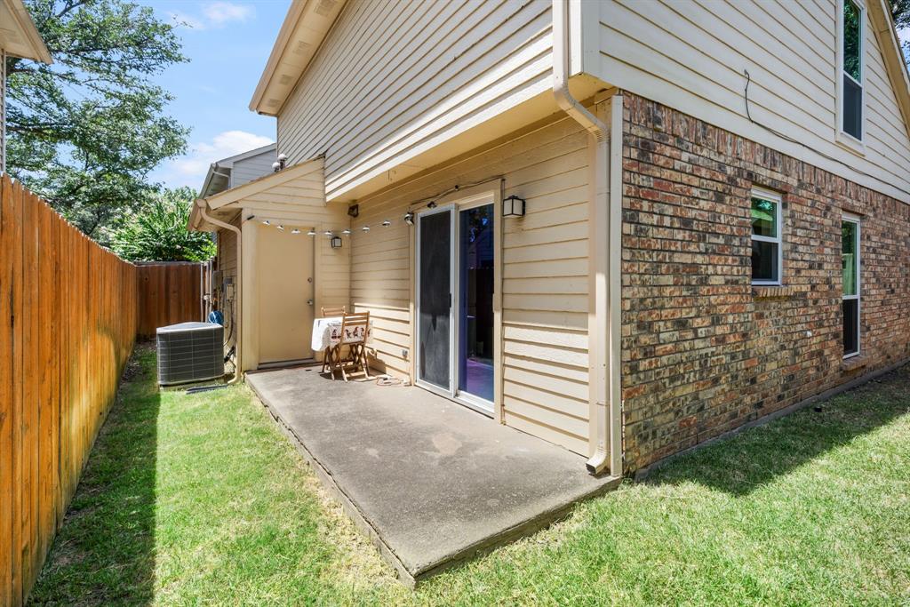 2960 Harbinger Lane Dallas, TX 75287 - Photo 22 of 25 a view of a backyard with plants and a patio