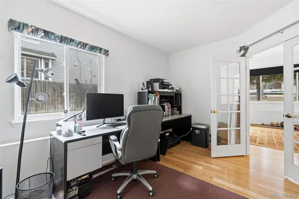 a workspace with furniture and wooden floor