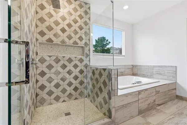 a bathroom with a bathtub and a shower