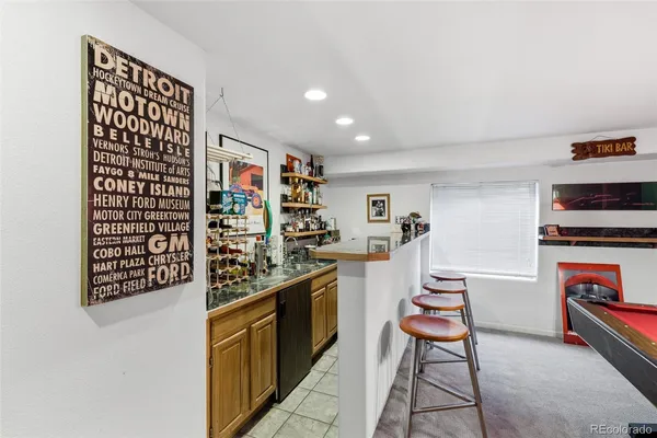 a open kitchen with stainless steel appliances a stove and cabinets