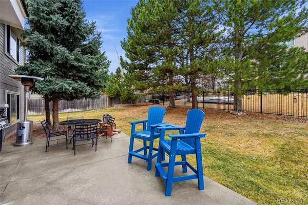a view of a chairs and table in the patio