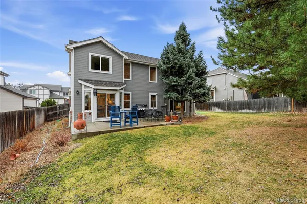 a view of a house with a yard patio and sitting area