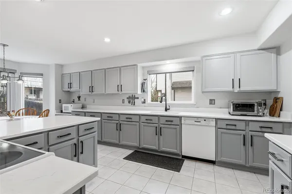 a kitchen with a sink and cabinets