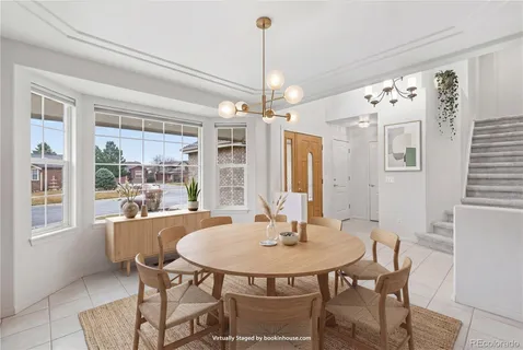 a view of a dining room with furniture window and outside view